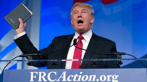 Republican presidential candidate, businessman Donald Trump, holds up his bible who was giving to him by his mother as he speaks during the Values Voter Summit, held by the Family Research Council Action, Friday, Sept. 25, 2015, in Washington ( AP Photo/Jose Luis Magana)